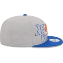 szara-i-niebieska-czapka-z-daszkiem-snapback-9fifty-draft-edition-2023-new-york-knicks-nba-new-era