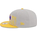 snapback-9fifty-draft-edition-2023-los-angeles-lakers-nba-od-new-era-szara-i-zolta-czapka-z-plaskim-daszkiem
