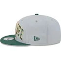 kepure-plokscia-pilka-snapback-9fifty-tip-off-2023-milwaukee-bucks-nba-new-era