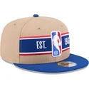 new-era-flat-brim-9fifty-draft-2024-nba-brown-and-blue-snapback-cap