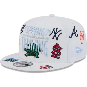 kepure-plokscia-balta-snapback-9fifty-scatter-spring-training-fan-pack-2025-mlb-new-era
