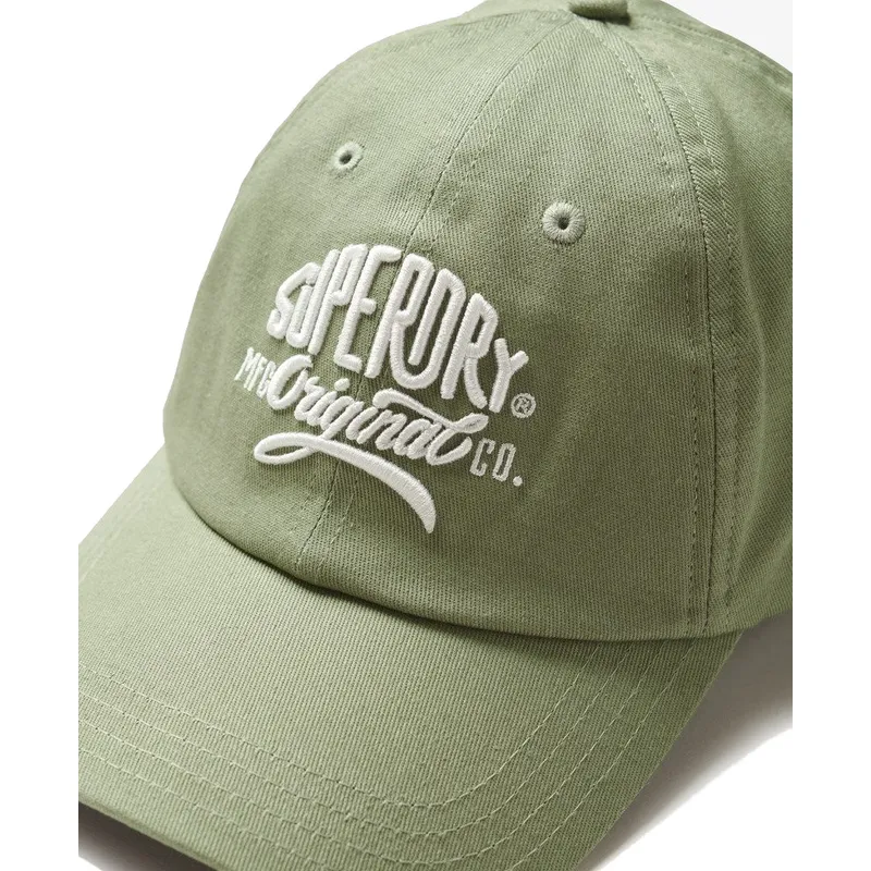 kepure-islenkta-zalia-reguliuojama-juostele-graphic-seagrass-green-superdry