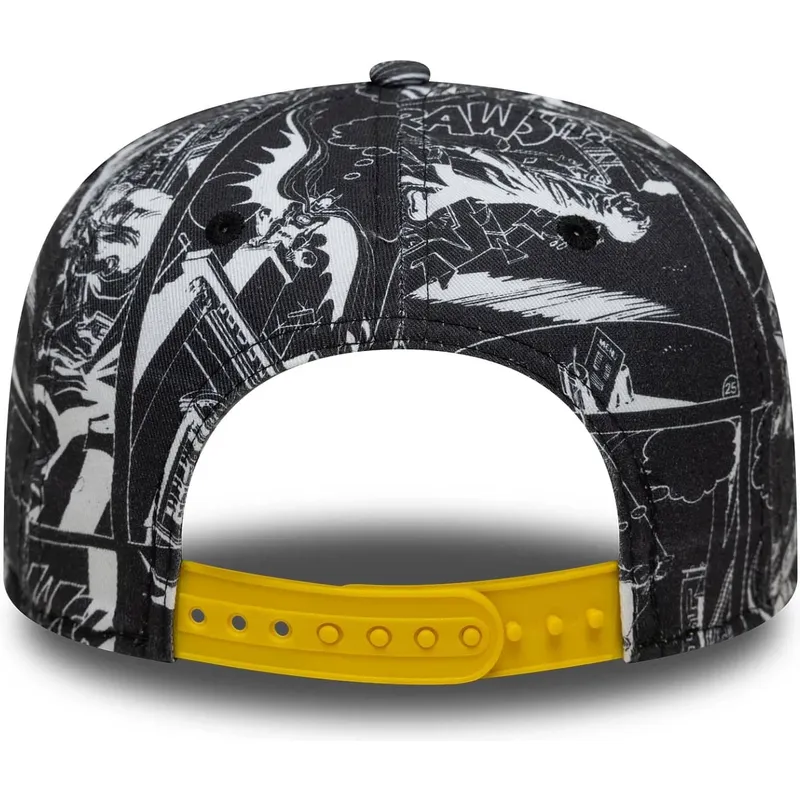kepure-plokscia-juoda-snapback-vaikams-9fifty-all-over-print-batman-dc-comics-new-era